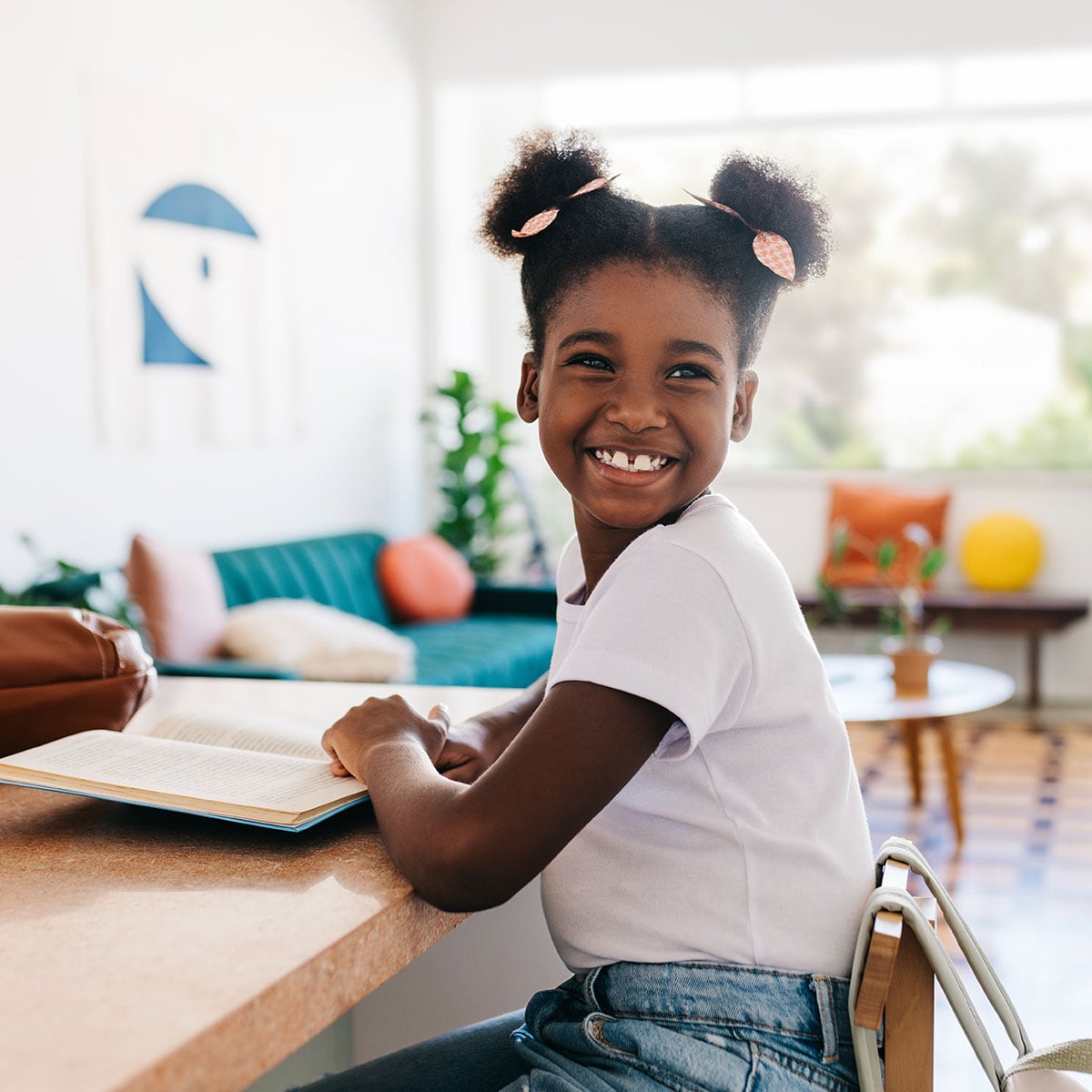 Young student reading in the classroom.