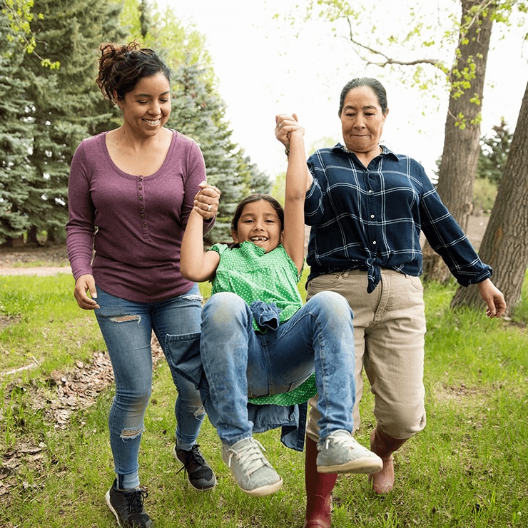 Image of mother playing with her child with her grandmother