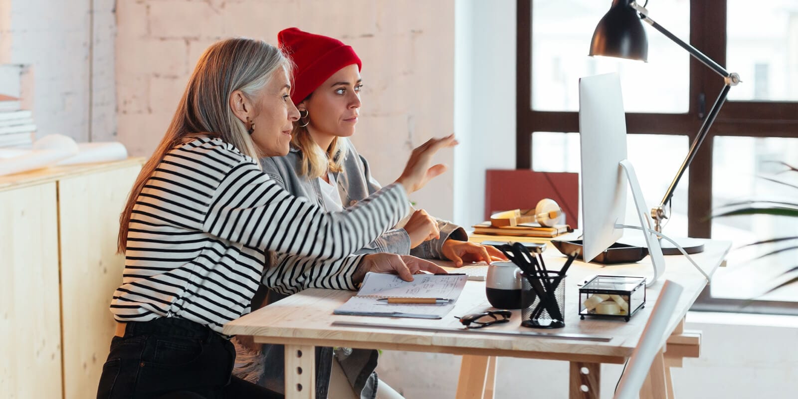 Two people looking at a computer screen