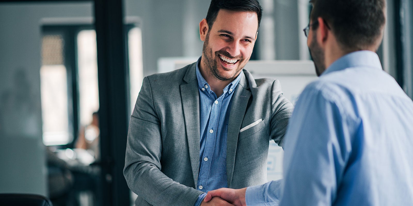 Two business people shaking hands