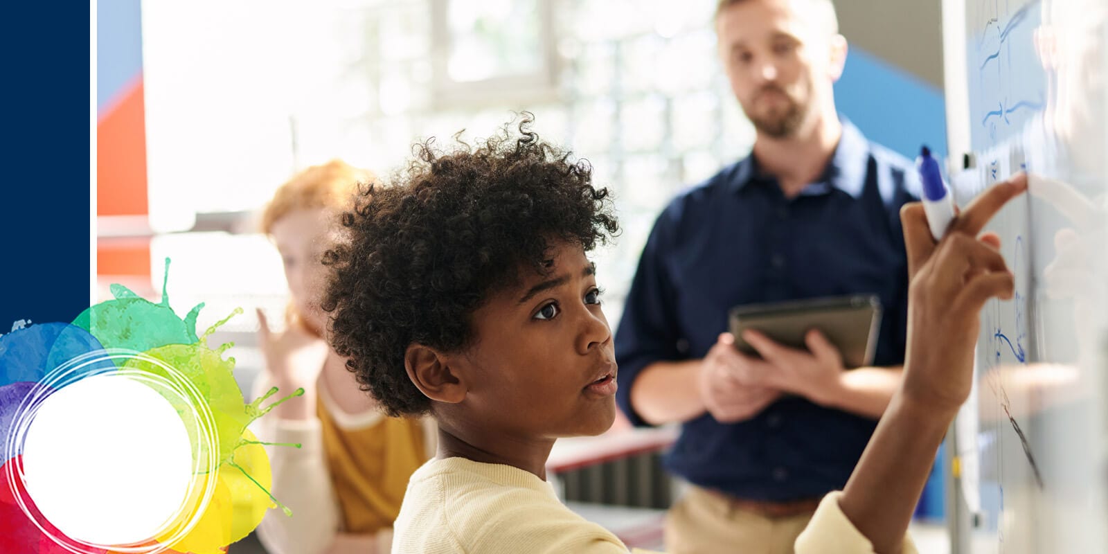 A classroom scene with a teacher, students, and a young boy with curly hair, looking on attentively.
