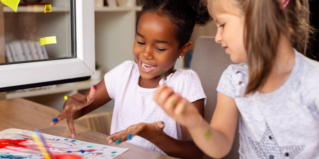 Little girls having fun painting