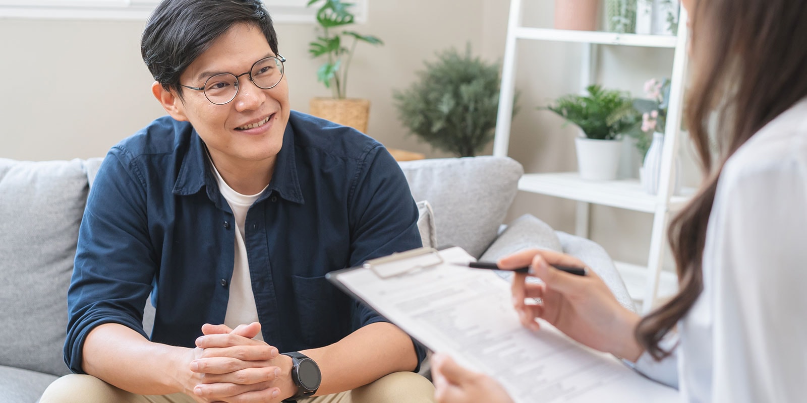 Clinical professional speaking with a patient. 