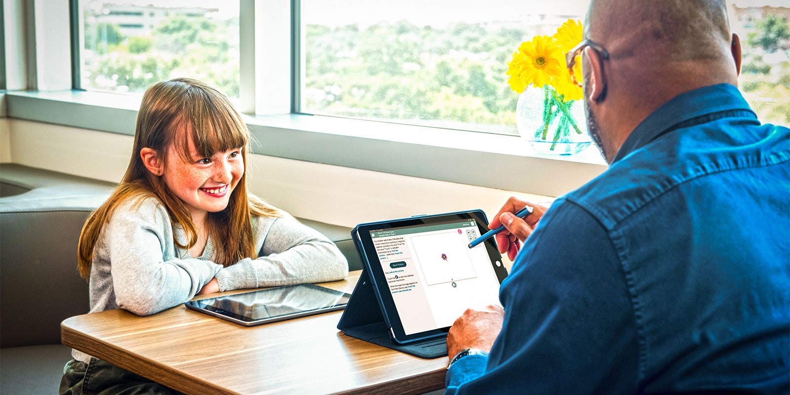 Student and teacher working together.