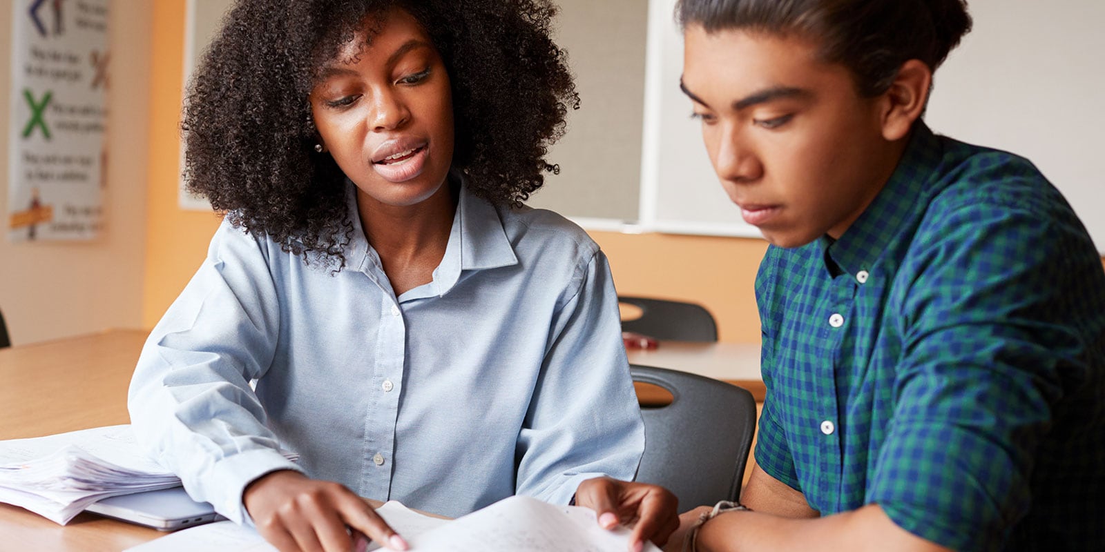 Two students discussing a lesson. 