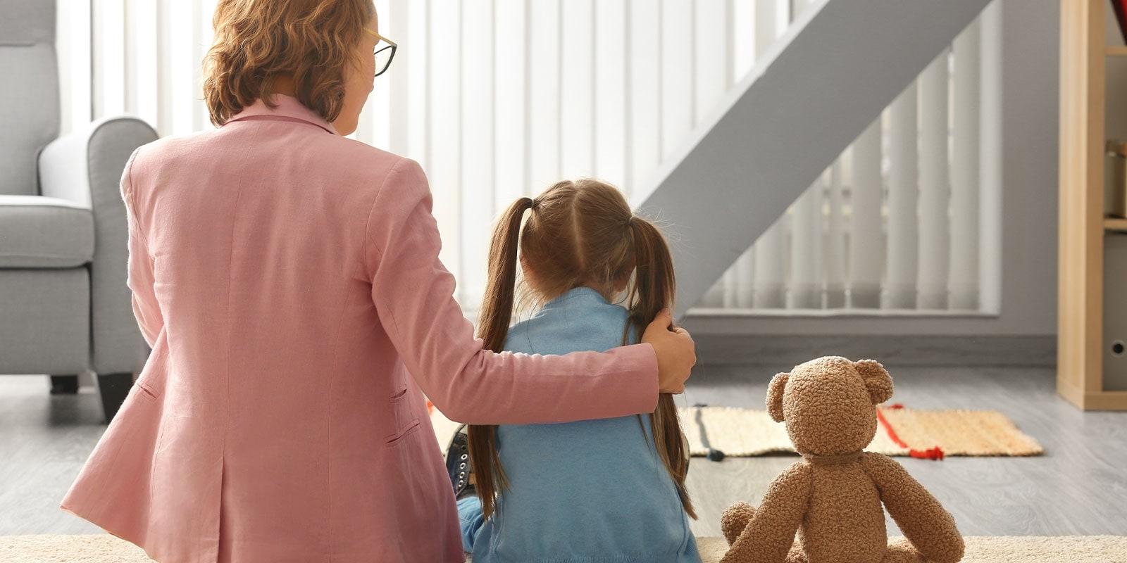 Female clinician working with a young girl.