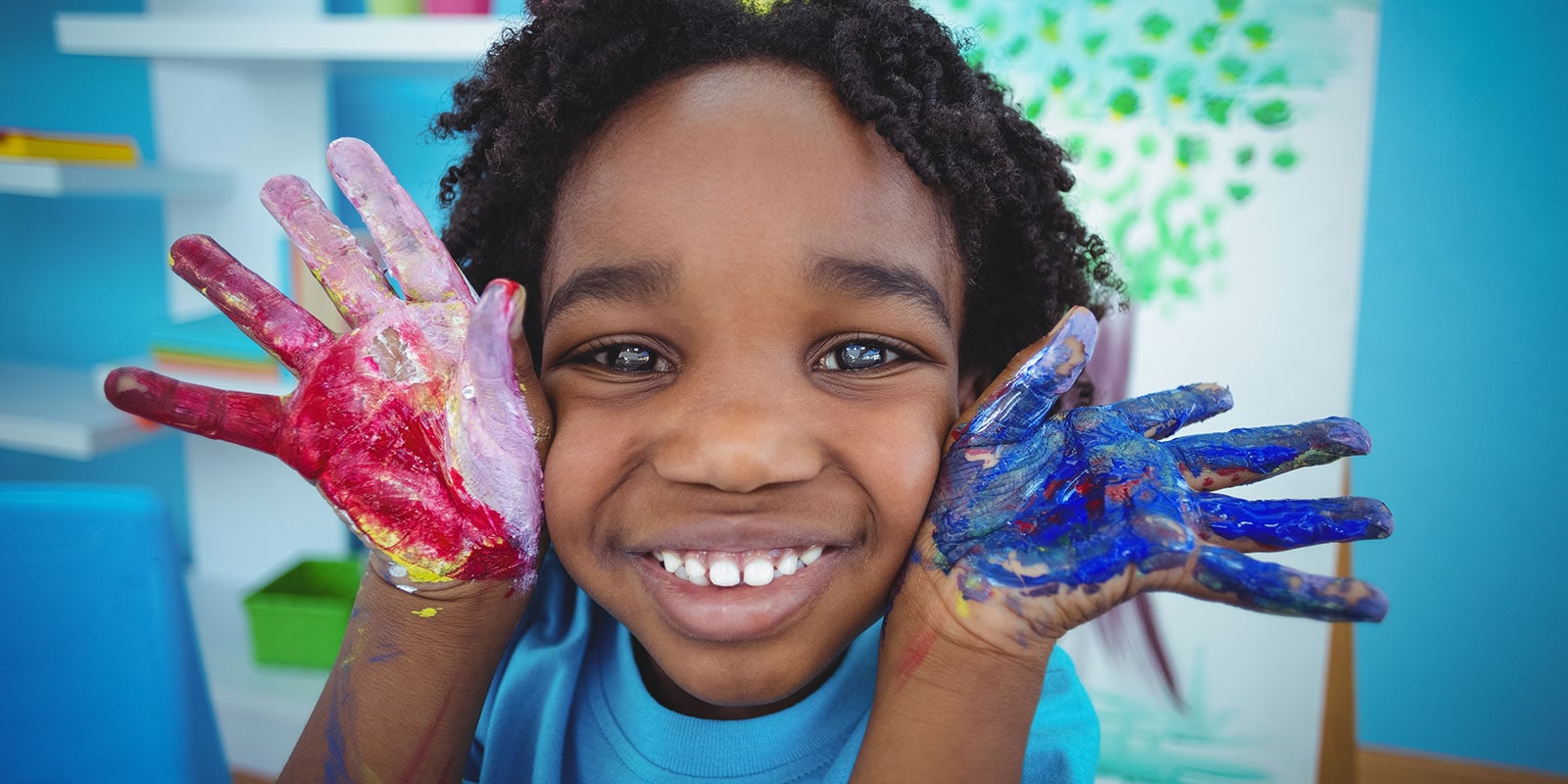 Child with paint on his hands. 