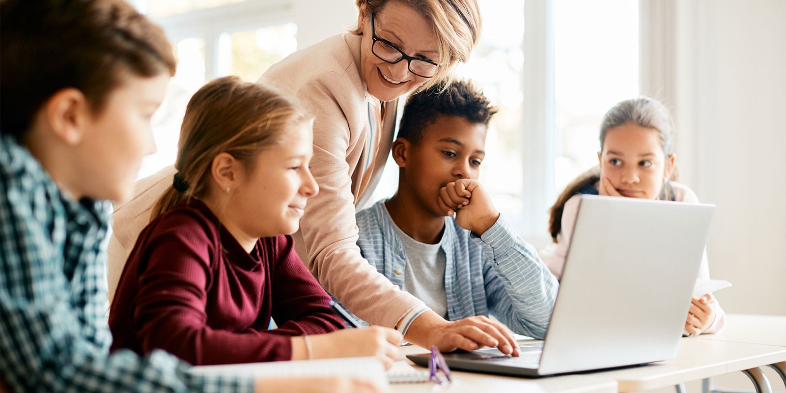 Student working with instructor in the classroom. 